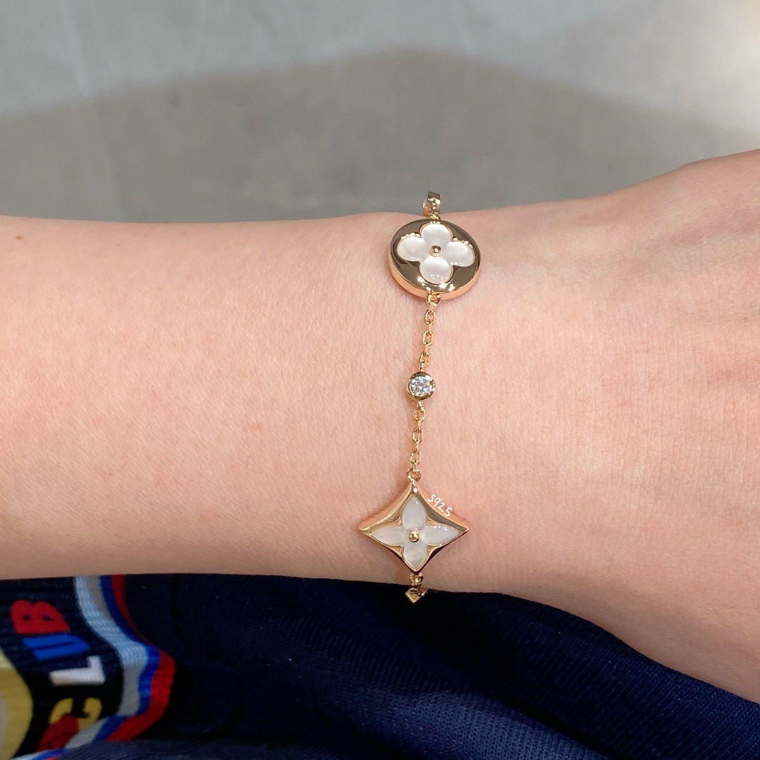 [Regalia jewelry]STAR AND SUN 4 MOTIF WHITE MOP PINK GOLD BRACELET