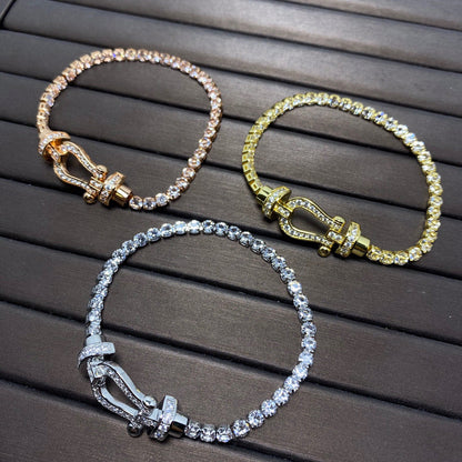 [Joyas Regalia]Pulsera de tenis Force con herradura grande y diamantes. 