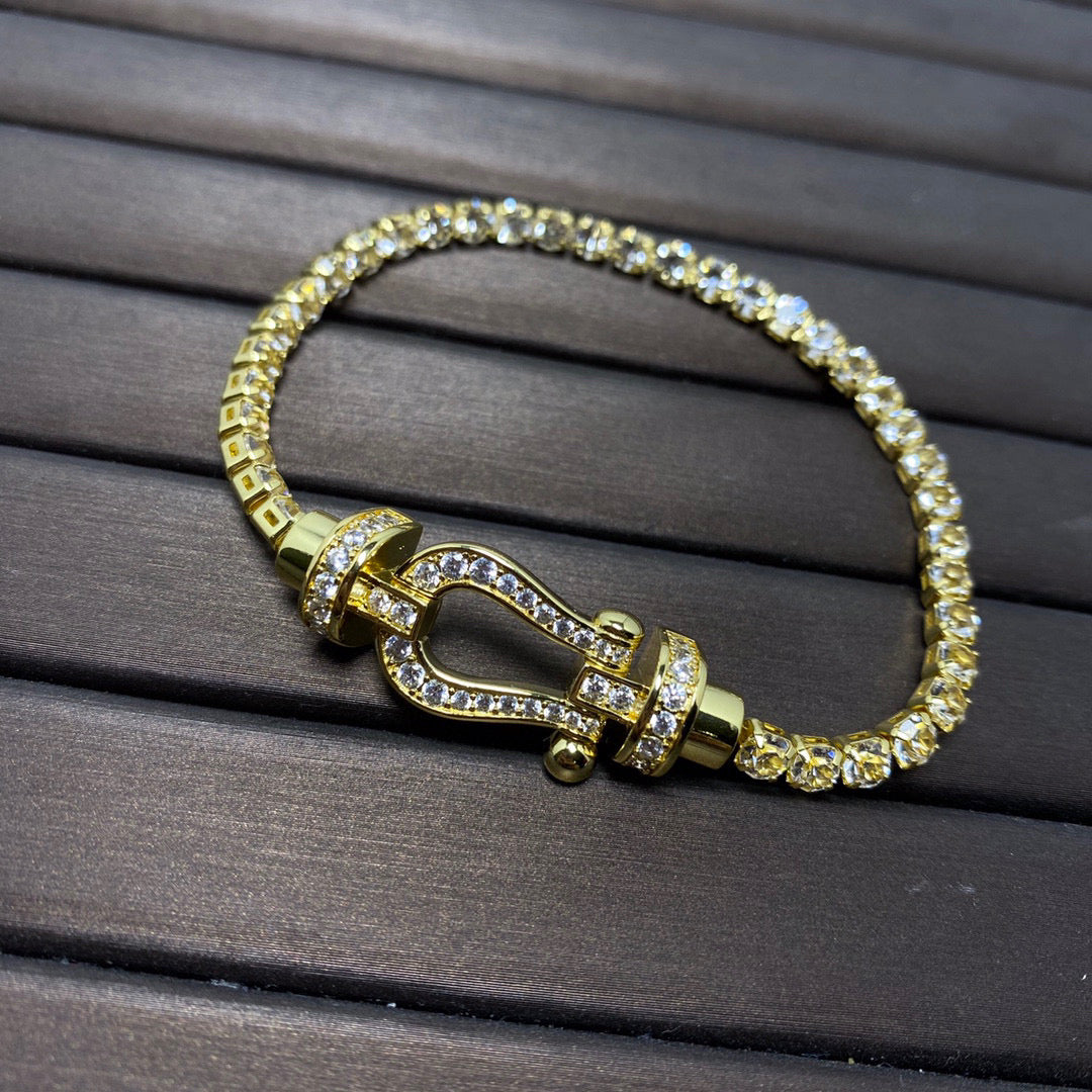 [Joyas Regalia]Pulsera de tenis Force con herradura grande y diamantes. 