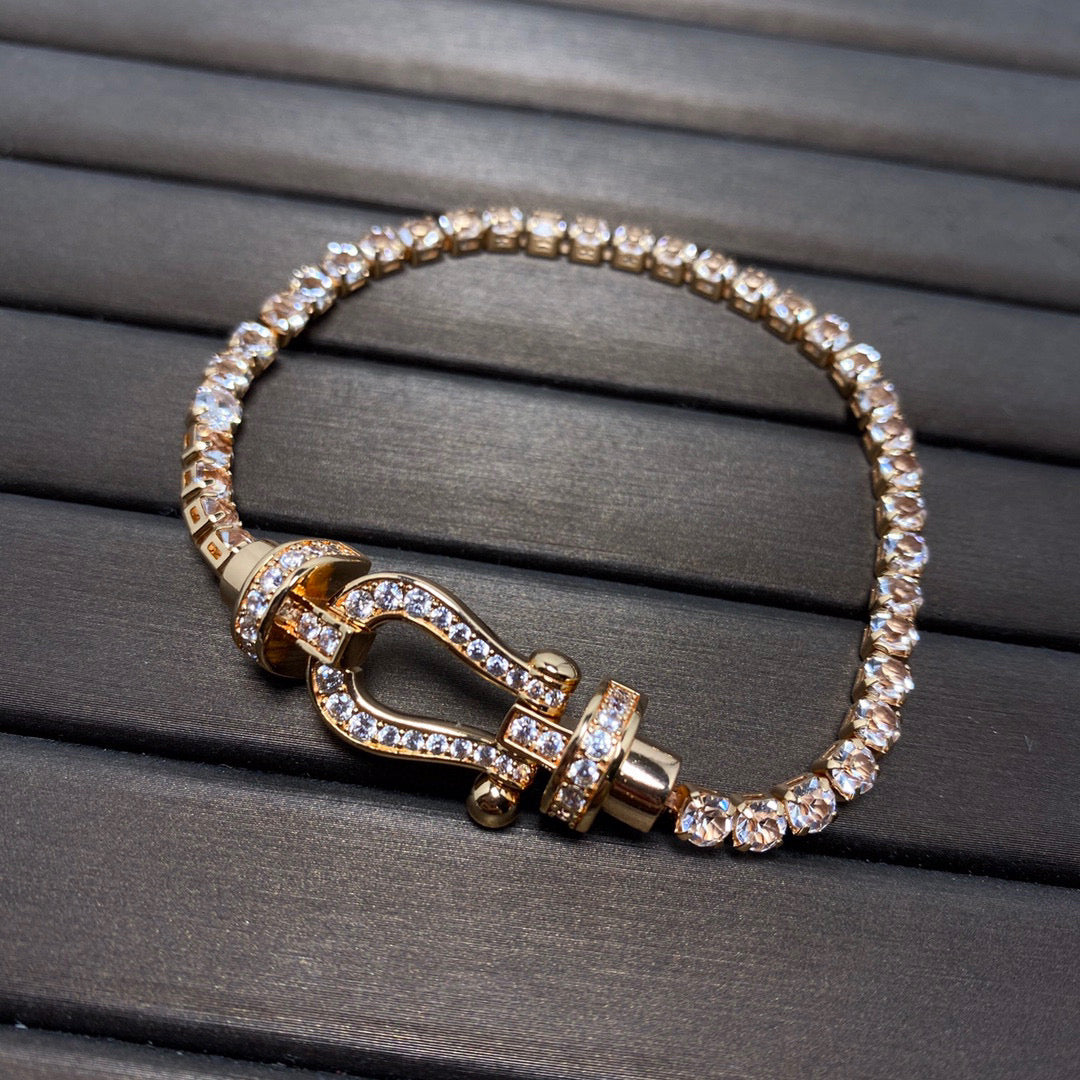 [Joyas Regalia]Pulsera de tenis Force con herradura grande y diamantes. 