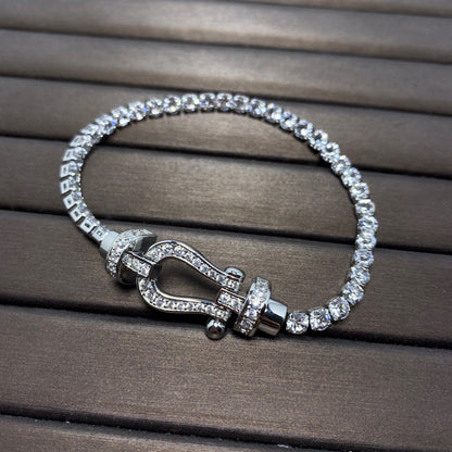 [Joyas Regalia]Pulsera de tenis Force con herradura grande y diamantes. 