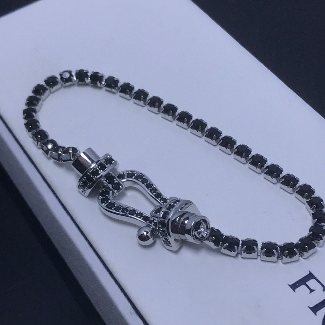 [Joyas Regalia]Pulsera de tenis Force con herradura grande y diamantes. 