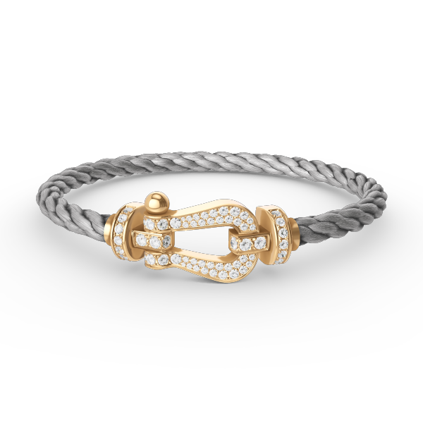 [Joyas Regalia]Pulsera de herradura grande con diamantes en oro.