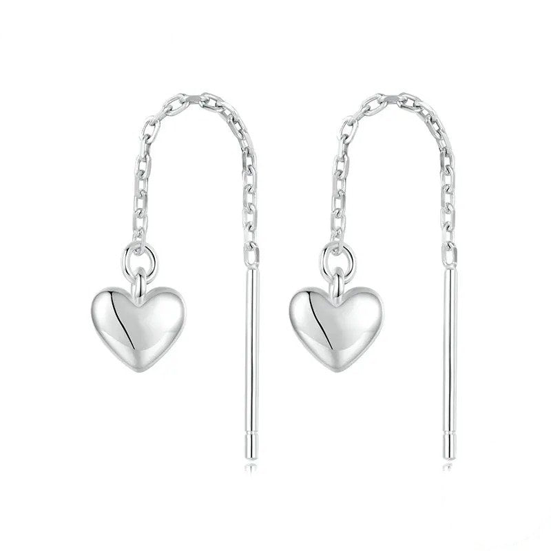 Pendientes largos con borlas y forma de corazón