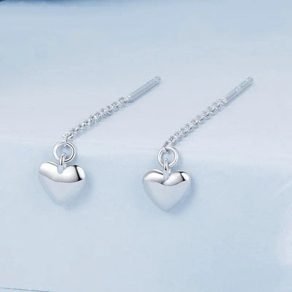 Pendientes largos con borlas y forma de corazón