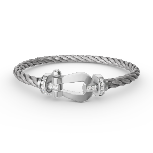 [Joyas Regalia]Pulsera de herradura grande con medio diamante en plata.