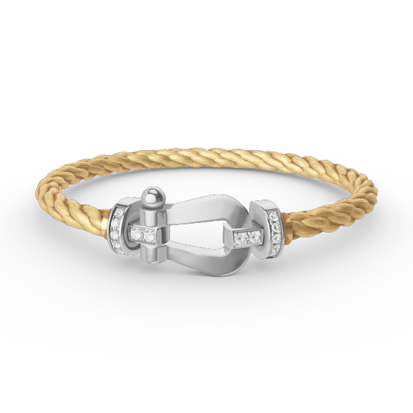 [Joyas Regalia]Pulsera de herradura grande con medio diamante en plata.